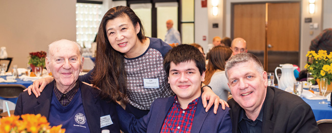 GENERATIONS: Charles Rosengard ’52, G’22, a member of the university’s founding class, with family members Lan Rosengard, P’22; Milo Rosengard ’22; and Daniel Rosengard, P’22, at the Family Weekend Legacy Brunch.